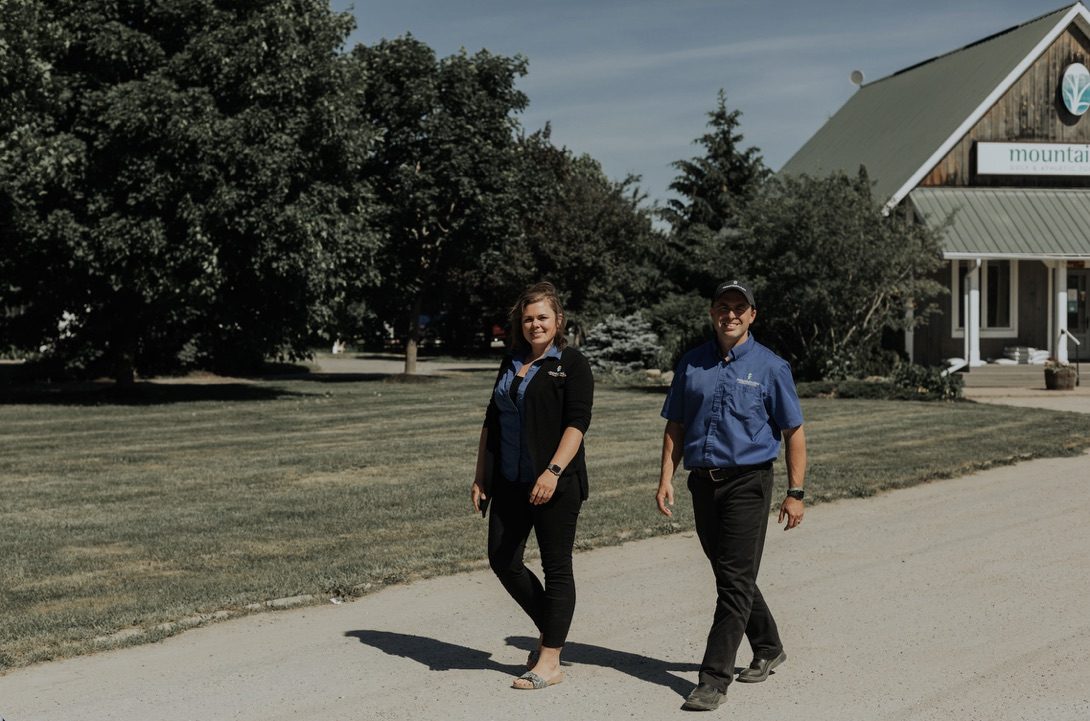 Jared and Lindsay Hamilton walking the lane at Mountainview Turf
